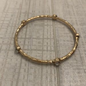 Gold bangle with stones